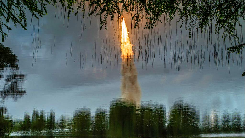 James Webb telescope reflected in water